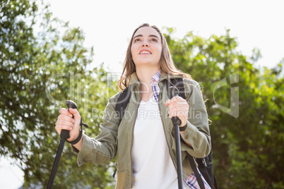 Smiling woman nordic walking