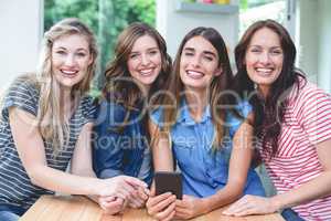 Beautiful women holding a mobile phone