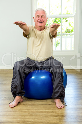 Portrait of senior man exercising