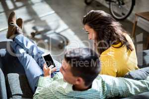 Colleagues using mobile phone