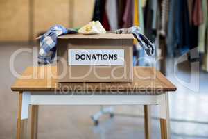 Donation box on a wooden table