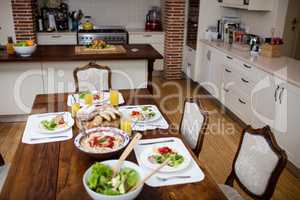 Dinning table laid with meal