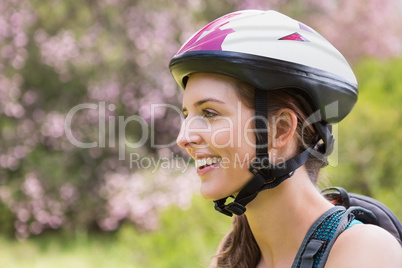 Smiling woman wearing a helmet