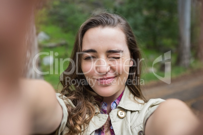 Smiling woman taking selfies