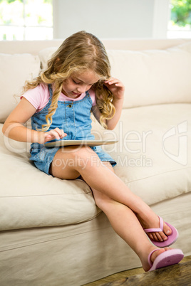 Cute girl using digital tablet