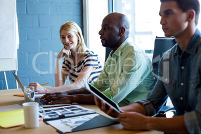 Colleagues sitting at their desk