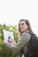 Woman using map and compass