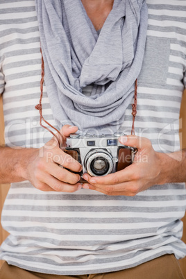 Man standing with a camera