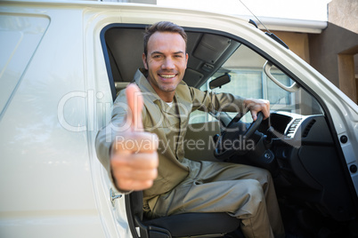 Delivery man sitting in his van