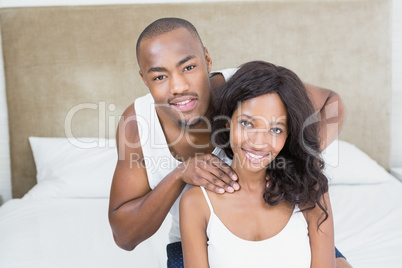 Portrait of young couple in the bedroom