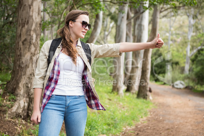 Portrait of woman hitch hiking