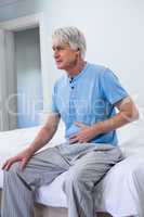 Senior man suffering from stomach pain