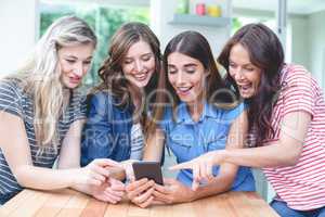 Beautiful women looking at the mobile phone