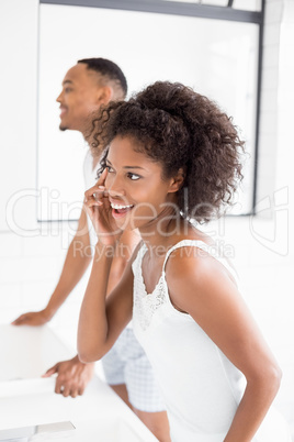 Woman checking her skin in bathroom