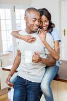 Young couple holding coffee mug