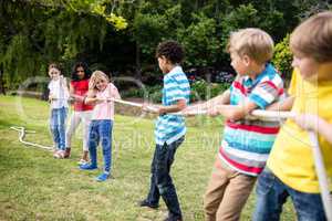 Children pulling a rope in tug of war
