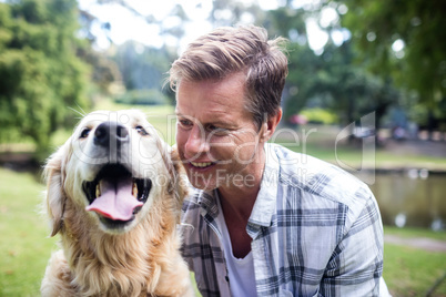 Smiling man with his pet dog
