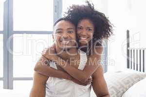 Young couple embracing each other in bedroom