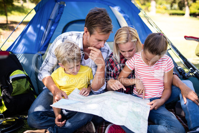 Family looking at a map