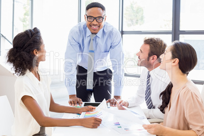 Businesspeople discussing a report