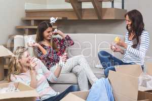 Playful friends throwing packing peanuts with each other