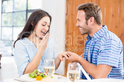 Man gifting finger ring to her woman