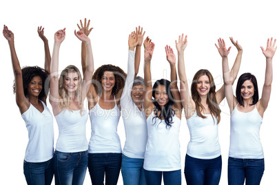 Happy multiethnic women standing with their hands raised