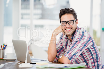 Young man sitting at his desk