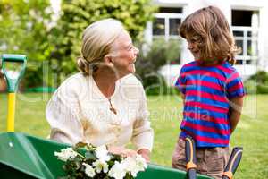 Smiling granny with grandson at yard