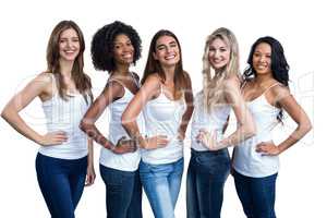 Portrait of multiethnic women standing with hand on hip