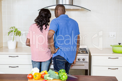 Young couple cooking food