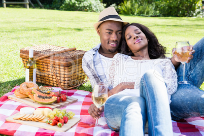 Young couple having a picnic in the park