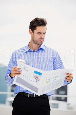 Businessman reading a newspaper