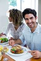 Portrait of happy man having meal