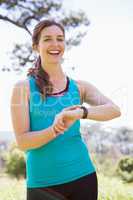 Smiling woman checking her watch