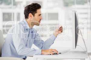 Businessman doing online shopping on computer