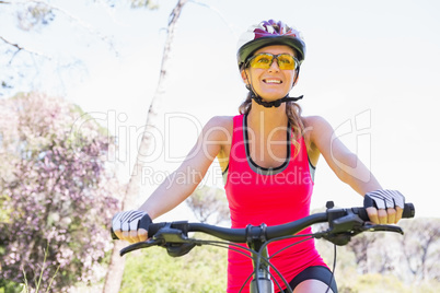 Smiling woman cycling