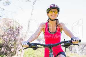 Smiling woman cycling