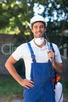 Portrait of confident insecticide worker