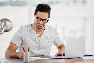 Young man working at his desk