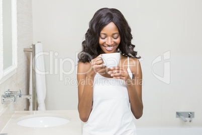 Young woman holding coffee mug