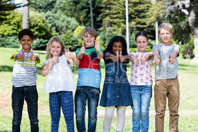 Portrait of happy children standing together in park