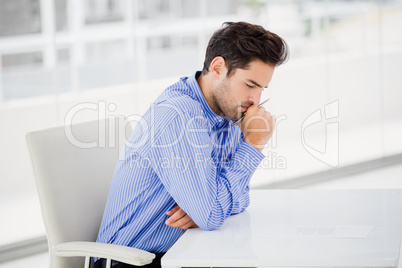 Businessman writing on paper