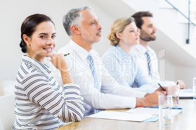 Business colleagues sitting together in meeting