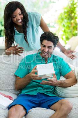 Surprised couple looking at the gift