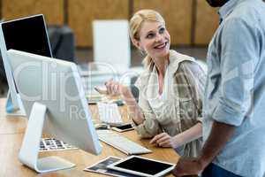 Colleagues working on computer together