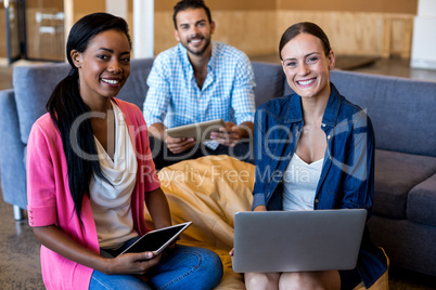 Colleagues smiling at camera