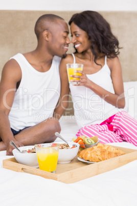 Young couple having breakfast