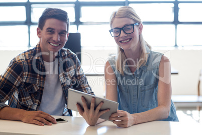 Colleagues interact using digital tablet