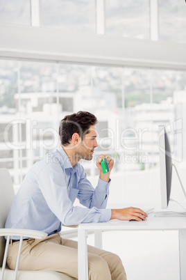 Businessman doing online shopping on computer